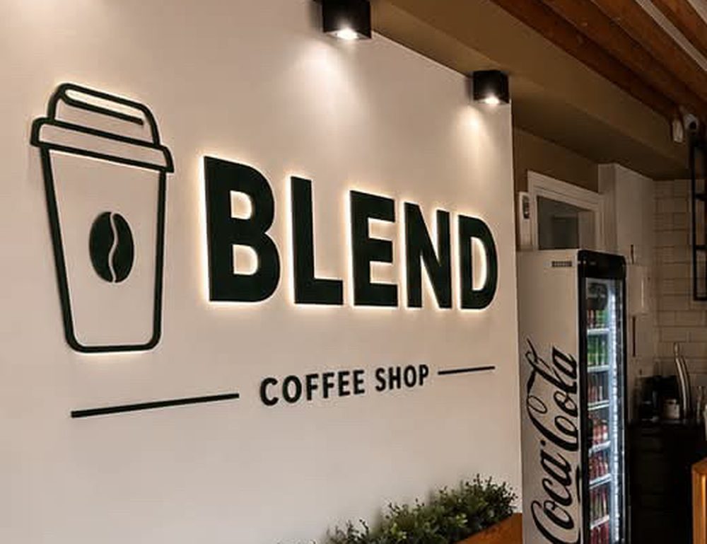 The Blend logo on the wall inside the shop